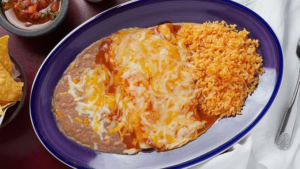 Enchilada · One enchilada served with rice and beans.