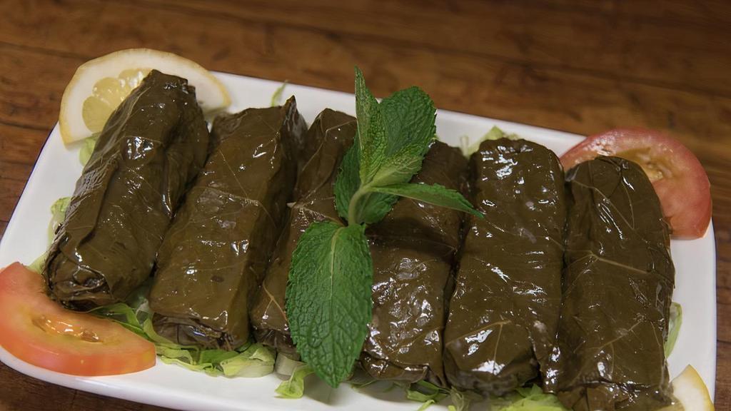 Dolma Grape Leaves Plate ورق عنب · Grape leaves stuffed with rice, tomatoes, onion and parsley cooked with seasoning.
