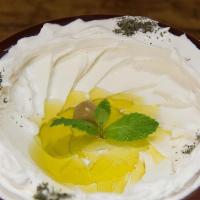 Tzatziki لبن مع خيار · Chopped cucumber and yogurt, seasoned with garlic and dried mint.