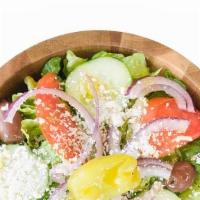Greek Salad · Cucumber, tomatoes, beets, pepperoncini, lettuce and feta cheese.