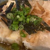 Agedashi Tofu (4Ps) · Lightly Battered and fried tofu with bonito flakes ，Green  onions serve fine tempura sauce