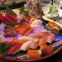 Love Boat · Twelve pieces nigiri sushi, Fifteen pieces sashimi with rainbow roll & one special roll.