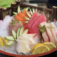 Sashimi Deluxe · Fifteen pieces assorted fresh raw fish.
