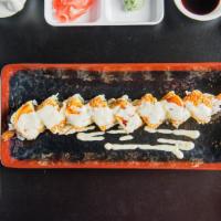 Lion King · tempura shrimp, jalapeno, cilantro, tuna topped w/ spicy crab, lime slice, mango sauce and e...