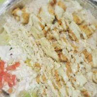 Chicken Tikka Plate · Marinated chicken breast pieces with a side of rice and salad