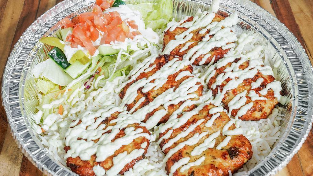 Chicken Chapli Kabob Plate · Chapli kabob (made from ground chicken and spices) with a side of rice and salad
