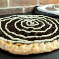 Oreo Bread · Caramel, Oreo crumbs , and topped with our amazing cream cheese frosting!