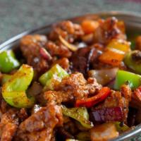 Chili Chicken   ( Gluten ) · Shredded boneless chicken sautéed with garlic, onion, peppers, red chilies, and soy sauce.