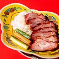 Char Siu Pork · Honey glazed Cantonese BBQ pork, sliced and served with steamed rice, pickle vegetables, and...
