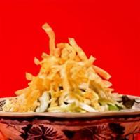 Cucumber Cabbage Salad · Sliced cucumbers, cabbage, cilantro and peanuts tossed in soy-ginger vinaigrette. Topped wit...