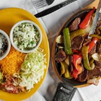 Sizzling Fajitas With One Large Side · Choose between steak, chicken, shrimp, or a combination of two. With peppers, onions, pico d...