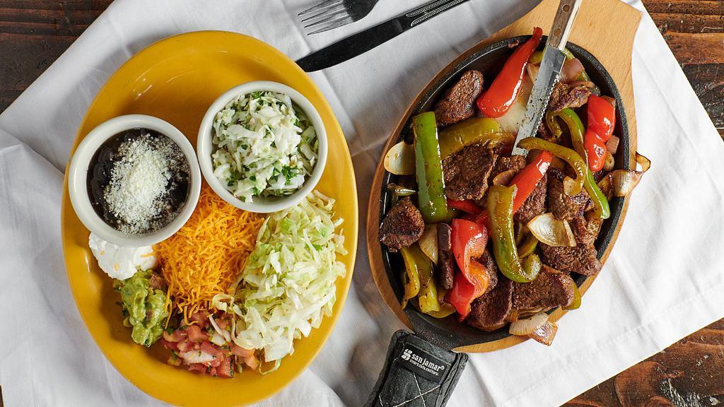 Sizzling Fajitas With One Large Side · Choose between steak, chicken, shrimp, or a combination of two. With peppers, onions, pico de gallo, guacamole, sour cream, lettuce and cheese.