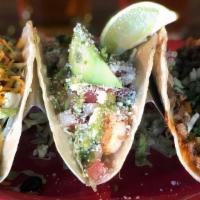 Street Cart Tacos With Two Small Sides · Ribeye or Chicken, onions, cilantro, jack cheese and smokey Arbol sauce. We recommend a corn...