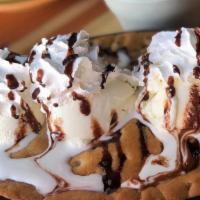 Loco Cookie Skillet · Served with vanilla bean ice cream whipped cream and chocolate sauce.