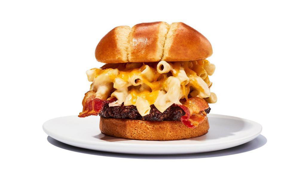 Bacon Mac & Cheese Burger · Savor comfort food at its finest with crispy bacon, creamy macaroni and cheese on Two 4oz Patties topped with shredded cheddar cheese. Includes choice of fries.