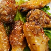 Chicken Wings · Crispy chicken wings mixed with your choice of sauce