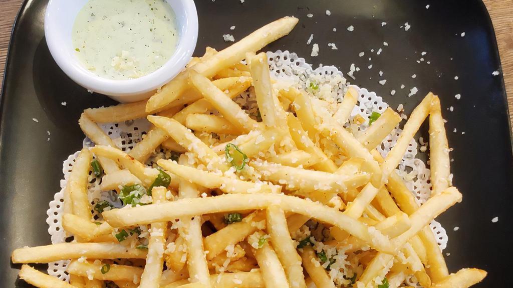 Truffle Fries · Vegetarian. Drizzled with truffle oil and topped with Parmesan cheese. Served with jalapeño house sauce.