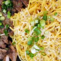 Garlic Parmesan Noodles · Garlic buttered noodles topped with parmesan chees. Served with jalapeno house sauce and you...