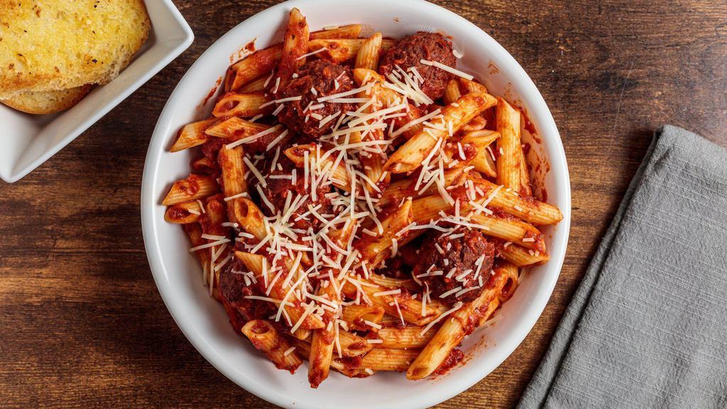 Penne Meats Balls · Slow cooked Italian meatballs simmered in marinara with penne pasta.   Served with a pretzel bread stick.