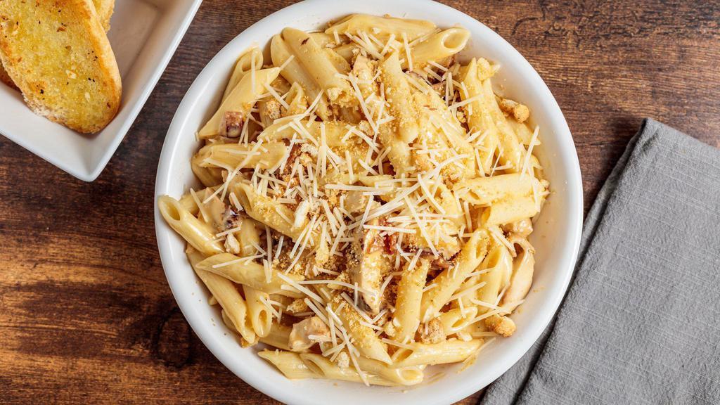 Chicken Baked Mac · Grilled chicken, bacon crumbles and creamy cheese sauce tossed in penne pasta finished with toasted breadcrumbs and parmesan cheese.  Served with a pretzel bread stick.