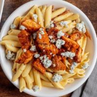 Buffalo Mac Mac · Bacon crumbles, creamy cheese sauce and penne pasta topped with crispy chicken tossed in med...