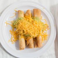 Three Rolled Tacos With Guacamole · Shredded beef deep fried rolled tacos with guacamole and cheese.