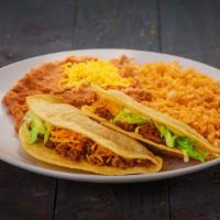 Two Beef Tacos · Two shredded beef tacos. Served with rice and beans.