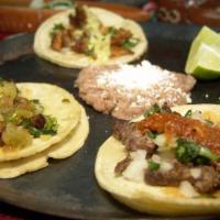 3  Street Taco Plate · Three tacos:  Asada/ Grilled Chicken/ Pastor / topped with onions cilantro and served with  ...