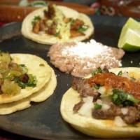 Street Tacos · 1 Taco: Asada/  Grilled Chicken / Pastor /  topped with onion's and cilantro. (Taco seleccio...
