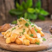 Cheese Fries · Delicious and golden fries topped with warm nacho cheese.