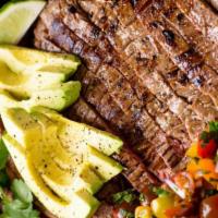 Mexican Steak Platter* · Nine ounce top sirloin, guacamole, two tortillas, potatoes -smothered with red salsa.