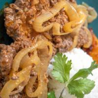 Encebollado Steak Platter* · With rice, beans, french fries, sauce wonions and bell peppers.