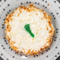 Key Lime Pie · Creamy Lime Custard topped Whipped Cream & garnished w/ Toasted Coconut.