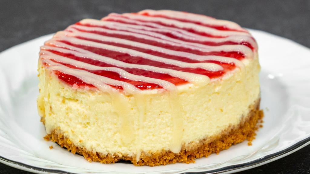 Raspberry-White Chocolate Cheesecake · White Chocolate Cheesecake swirled with real Raspberry Puree.