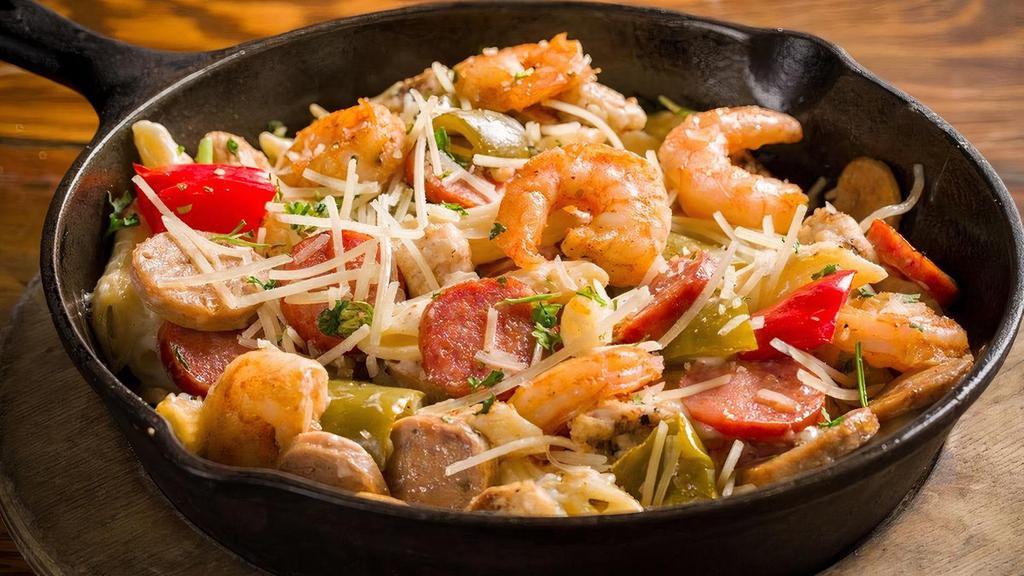 Spicy Born On The Bayou Pasta · Blackened shrimp, chicken, hot Italian and Andoille sausage, garlic, parsley, roasted bell peppers, Parmesan cheese, penne pasta, cream sauce