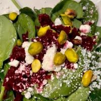 Togo Spinach Salad · Roasted beets, feta cheese, pistachio, pickled shallots, white balsamic dressing.