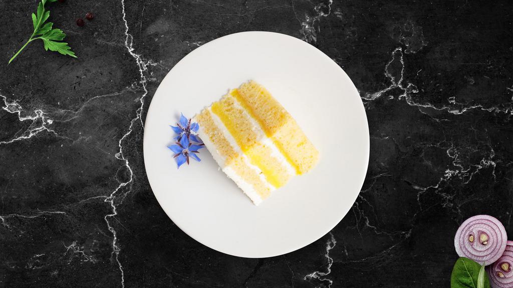 Tres Leches Cake · Delicious light sponge cake topped with a light whipped frosting