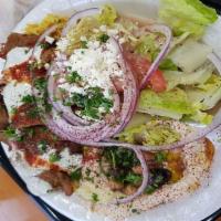 Shawarma Platter · Your choice of (lamb and beef) or marinated chicken breast grilled with onions, tomatoes, gr...