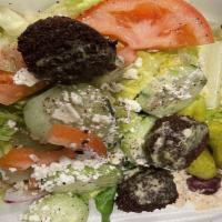 Falafel Platter · Falafel served with hummus, pita and greek salad.