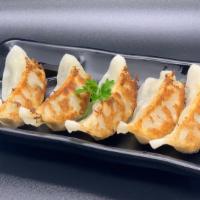 Gyoza (5 Pieces) · Japanese crispy dumplings filled with pork and veggies.