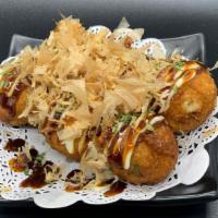 Takoyaki (6 Pieces) · Deep-fried octopus bites topped with takoyaki sauce, mayo, and bonito flakes.
