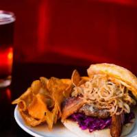 The Belltown Burger · Nicky farms beef, fried onion strings, cheese, house BBQ sauce, pickles, lettuce, and tomato...