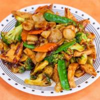 Fried Tofu With Vegetables · Fried tofu with an assortment of veggies, stir fried in a brown sauce. Served with steamed r...
