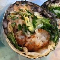 Chipotle Potato Burrito · Crispy potatoes with vegetarian black beans, romaine lettuce, crema de chipotle, habanero sa...