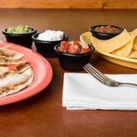 Chicken Quesadilla · Grilled chicken, melted Jack cheese and pico de gallo. Served with a handful of chips and a ...