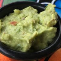 Side Of Chunky Guacamole · A condiment size portion of our housemade chunky guacamole.  Onion, lime, tomato, cilantro a...
