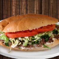 Torta · Mexican sandwich with beans, lettuce, tomatoes, and guacamole. Filled with your choice of ca...