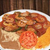 Camarones A La Diabla · Shrimp and mushrooms cooked with hot red sauce.