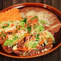Tacos Al Carbón · Chopped grilled chicken or steak cooked with chopped bacon and pico de gallo.