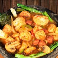 Molcajete “El Mirador” Style · The best,  grilled shrimp, steak, chicken, cooked with our special molcajete hot sauce, serv...